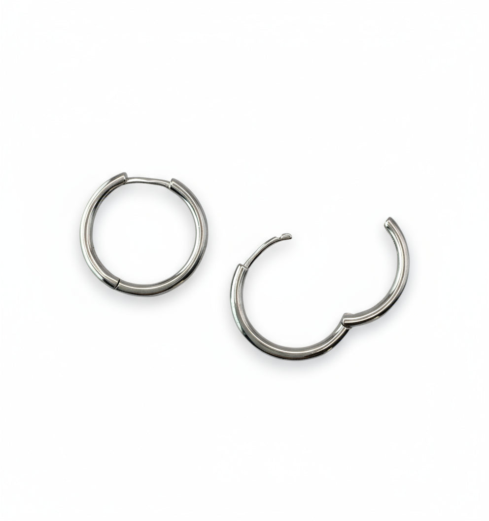 Pair of silver hoop earrings on a white background