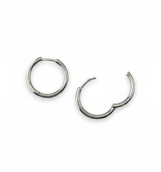 Pair of silver hoop earrings on a white background