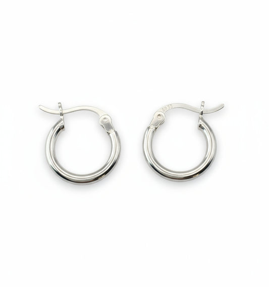 Pair of silver hoop earrings on a white background