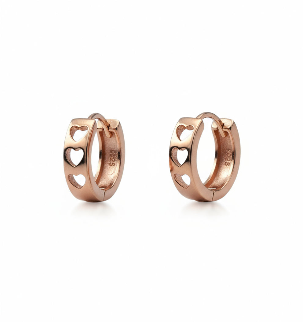 Pair of rose gold hoop earrings on a white background