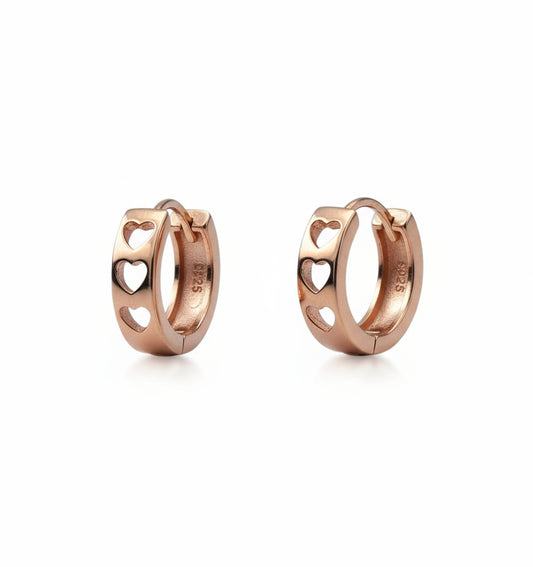 Pair of rose gold hoop earrings on a white background