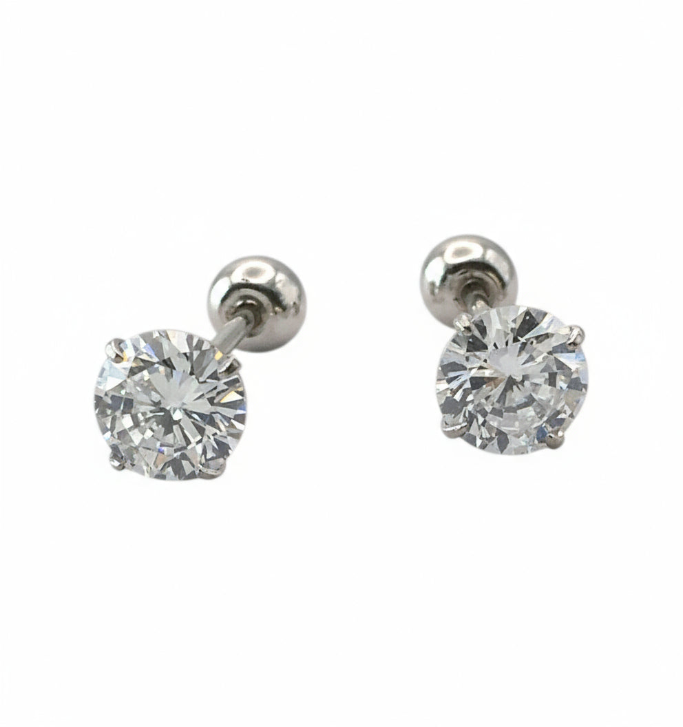 Pair of silver stud earrings with clear gemstones on a white background