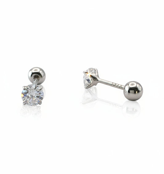 Pair of silver stud earrings with clear gemstones on a white background