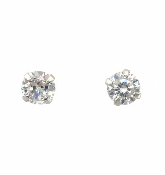Two diamond stud earrings on a white background