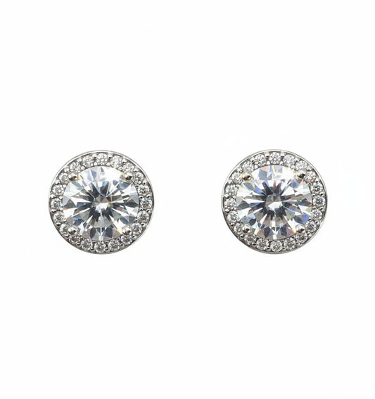 Pair of silver stud earrings with clear gemstones on a white background