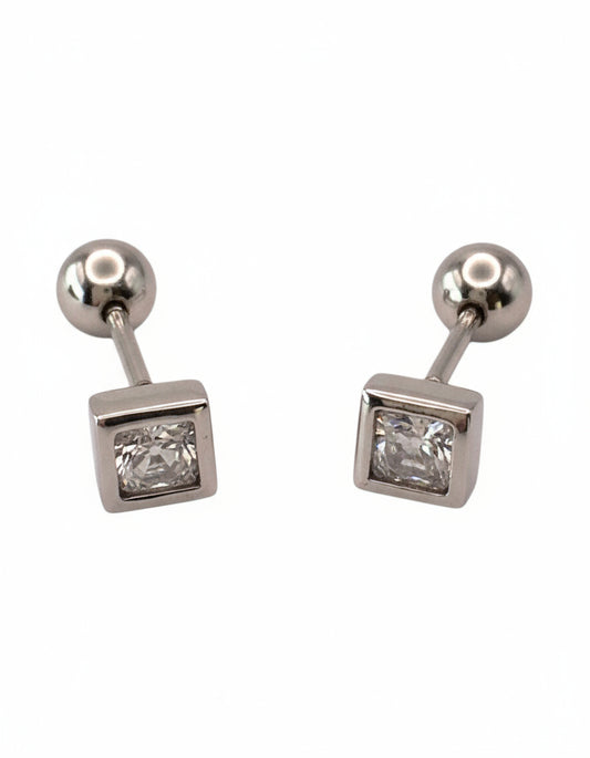 Pair of silver earrings with square gemstones on a white background