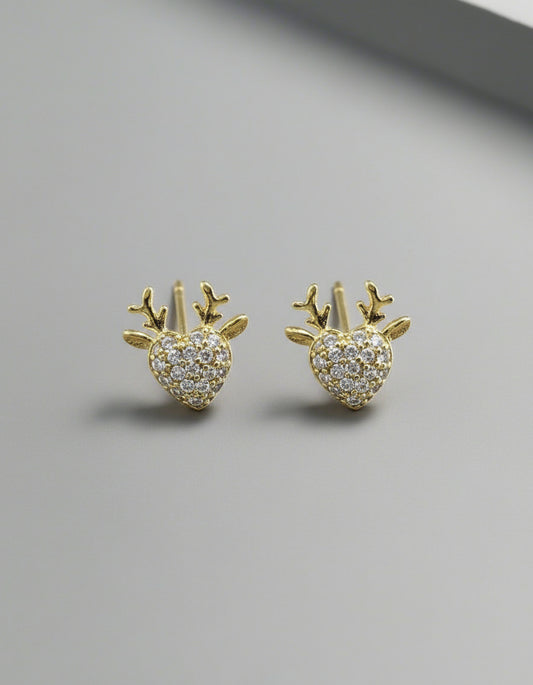 Gold earrings with heart and antler design on a white background