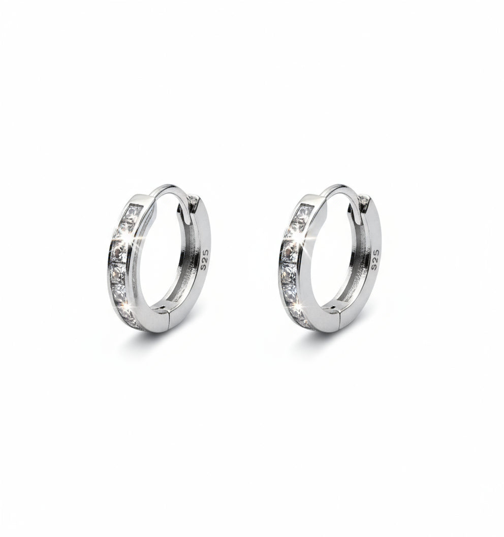 Pair of silver hoop earrings with 'S925' stamp on a white background