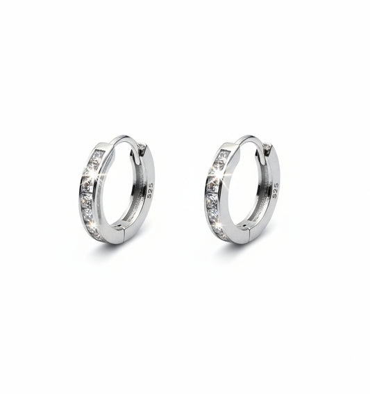 Pair of silver hoop earrings with 'S925' stamp on a white background