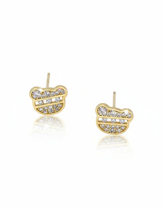 Gold and diamond-studded earrings on a white background