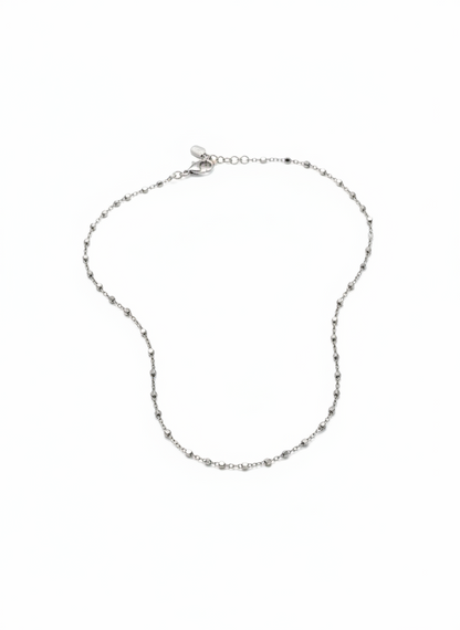 Silver chain necklace on a white background