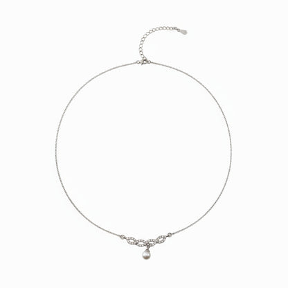 Silver necklace with a small pendant on a white background