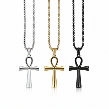 Three cross-shaped pendants on chains against a white background