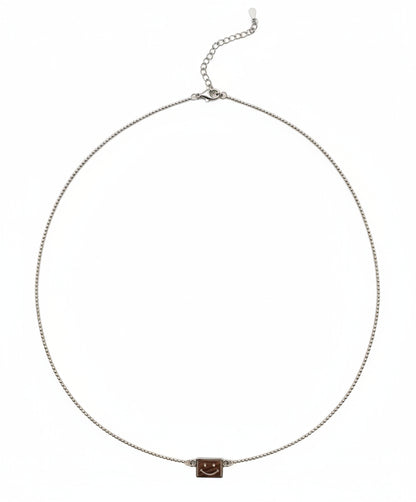 Necklace with a small square pendant on a white background