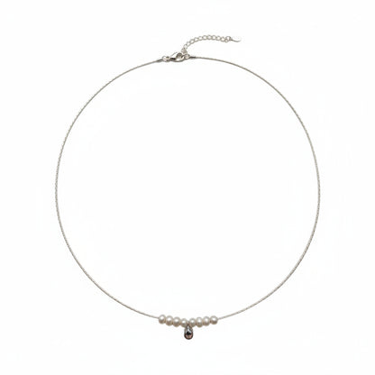 Necklace with pearls and a black pendant on a white background