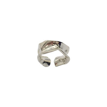 Silver open ring on a white background