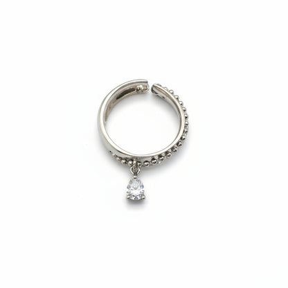 Silver hoop earring with a small gemstone on a white background