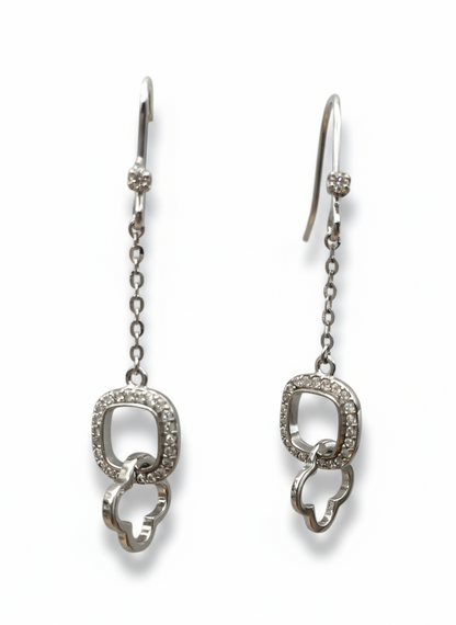 Pair of silver earrings with chain details on a white background