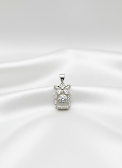 silver pendant with diamond accents on a white background