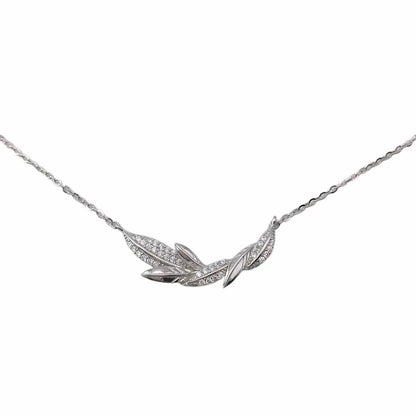 Silver necklace with leaf-shaped pendant on a white background