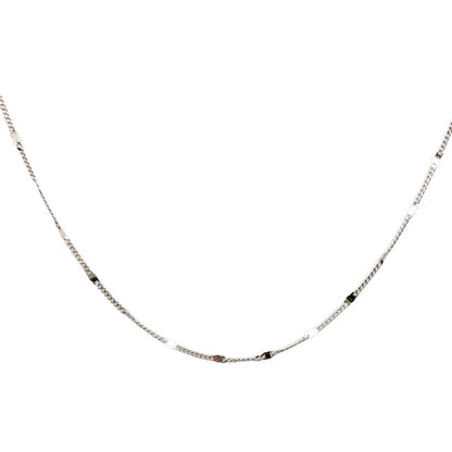 Silver chain necklace on a white background