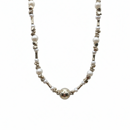 Necklace with pearls and silver beads on a white background