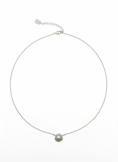 Necklace with a single pearl pendant on a white background