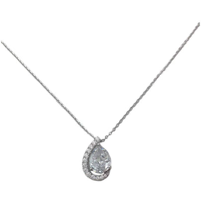 Teardrop-shaped diamond pendant on a chain against a white background