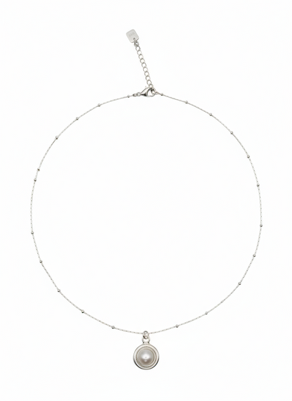 Silver necklace with a pendant on a white background