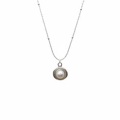 Necklace with a pearl pendant on a white background