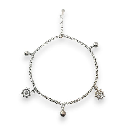 Silver bracelet with charms on a white background