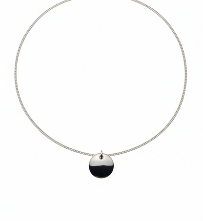 Necklace with a black pendant on a white background
