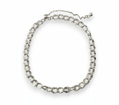 Silver chain bracelet on a white background