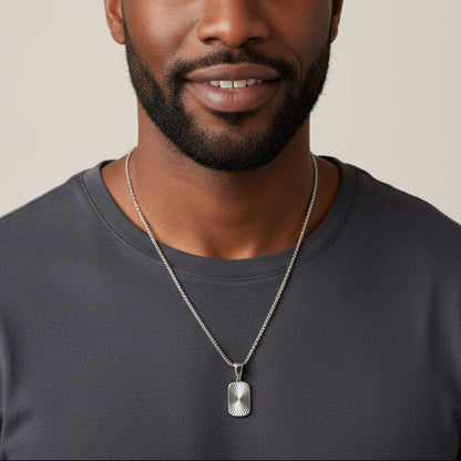 Silver necklace with a pendant on a white background