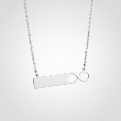 Silver necklace with a unique pendant design on a white background