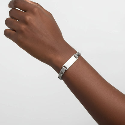 Silver bracelet with a chain design on a white background