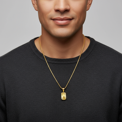 Gold necklace with a pendant on a white background