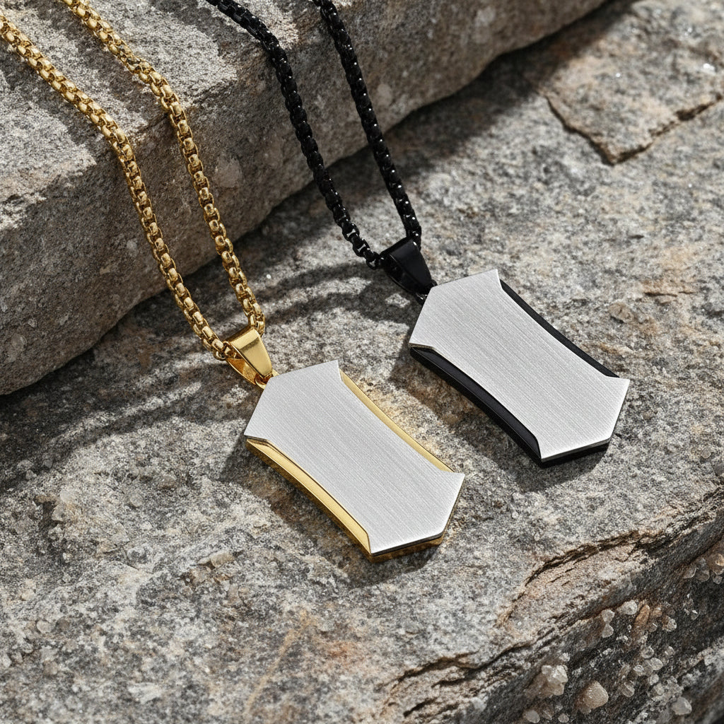Two necklaces with geometric pendants on a light background