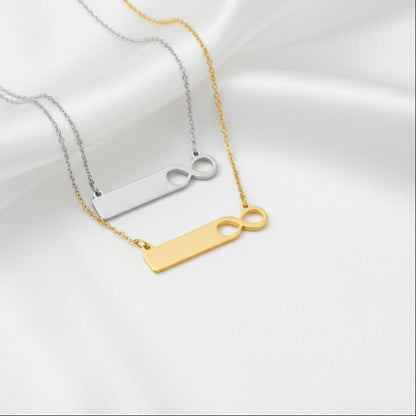 Gold necklace with a unique pendant on a white background