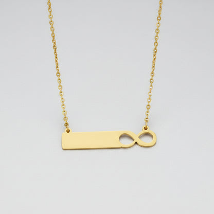 Gold necklace with a unique pendant on a white background