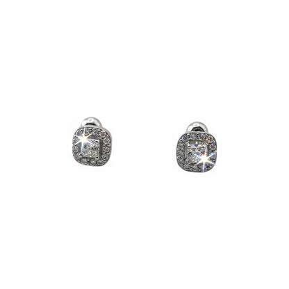 Pair of silver earrings with gemstones on a white background