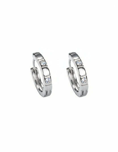 Pair of silver hoop earrings with embedded stones on a white background