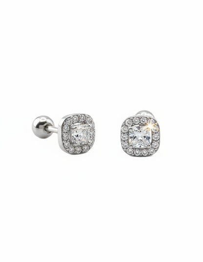 Pair of silver earrings with cubic zirconia on a white background