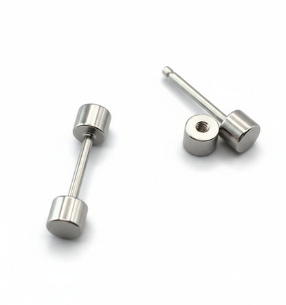 Pair of silver stud earrings on a white background