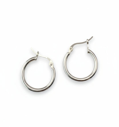 Pair of silver hoop earrings on a white background
