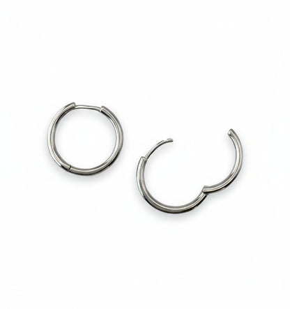 Pair of silver hoop earrings on a white background
