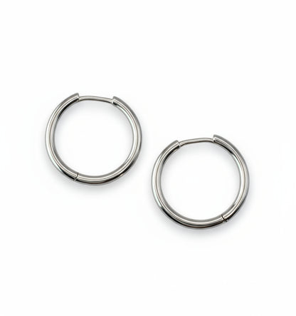 Pair of silver hoop earrings on a white background