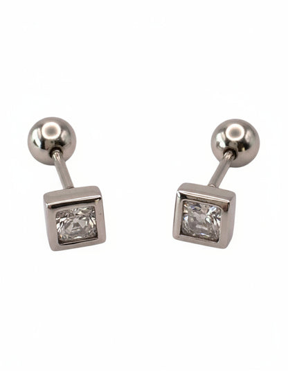 Pair of silver earrings with square gemstones on a white background