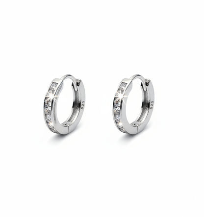 Pair of silver hoop earrings with 'S925' stamp on a white background