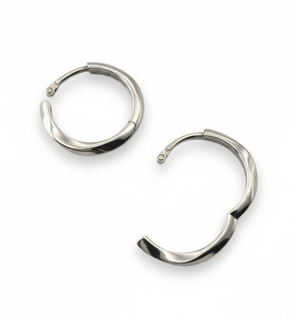 Pair of silver hoop earrings on a white background